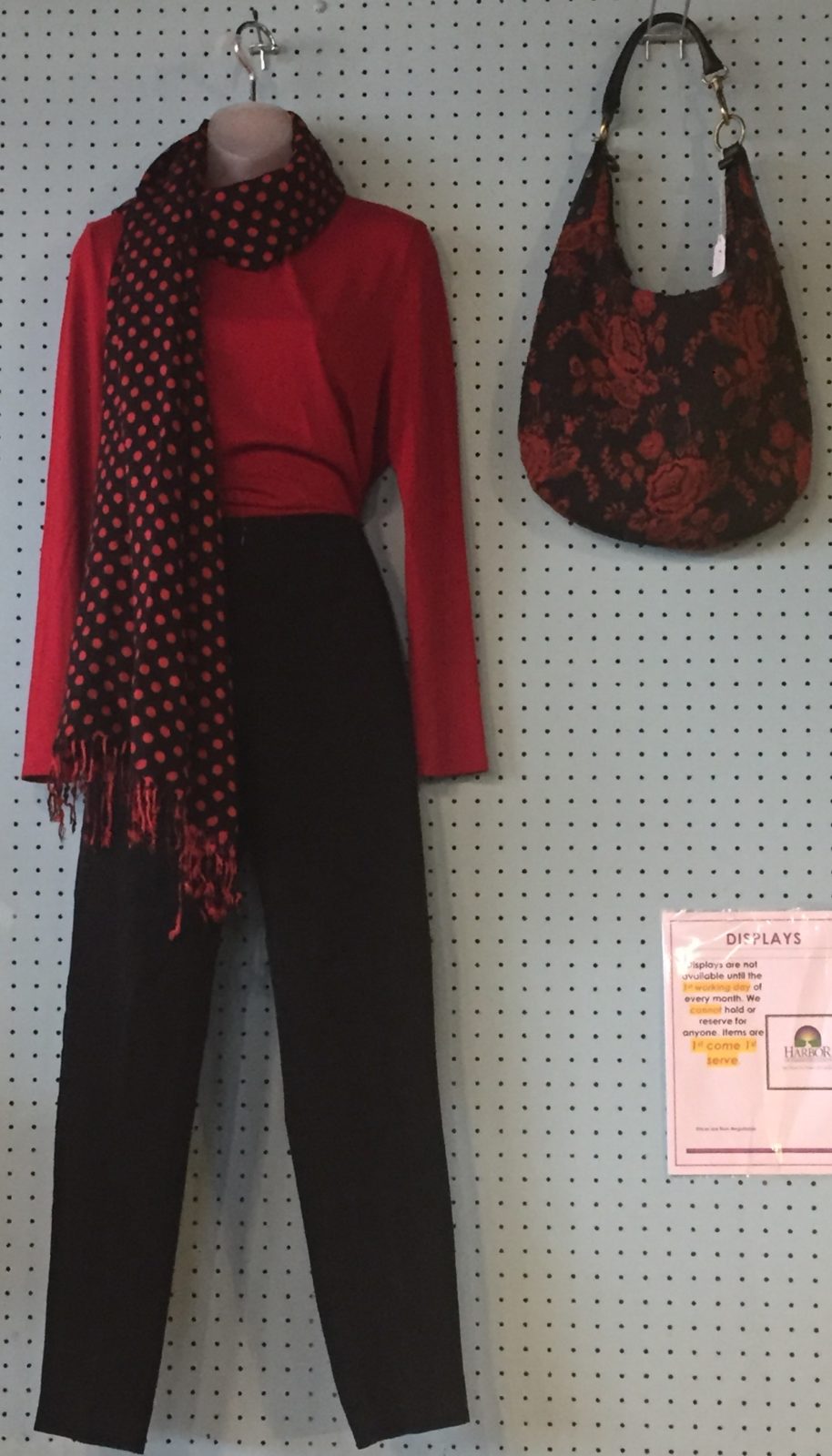 Red and black ensemble • Red long sleeve shirt, black dress pants, polka dot scarf, and red and black handbag.